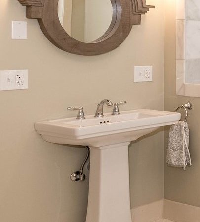 pedestal sink installed in bathroom