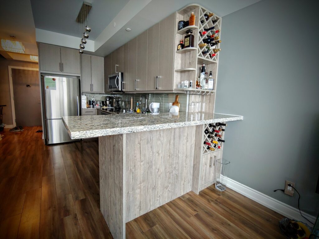 custom kitchen in condo with wine shelves - custom shelving units