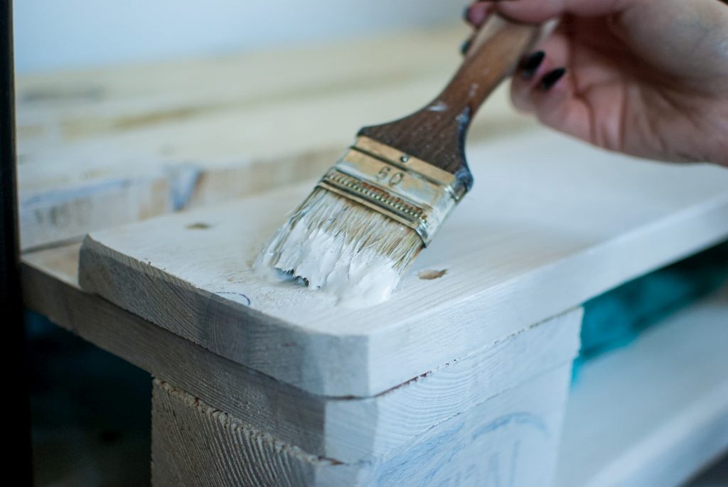 photo of wood painting with a brush