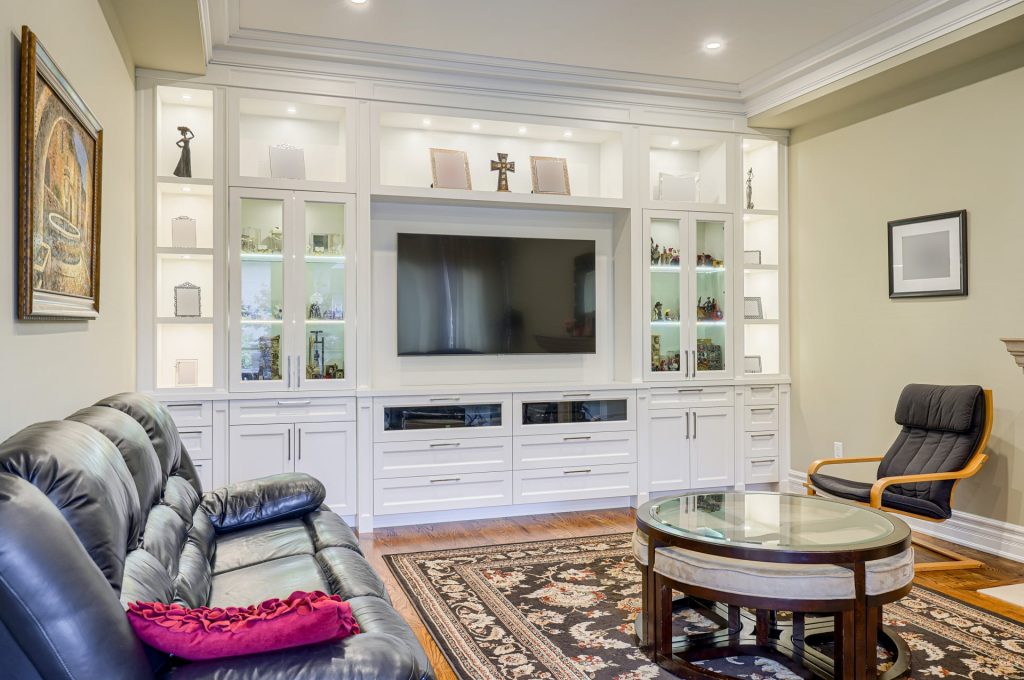 amazing living room with crown moulding and baseboard trim - renovation company