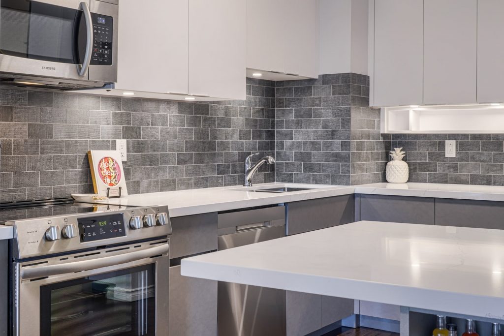 classic kitchen with tile backsplash and build in appliances - kitchen renovators toronto