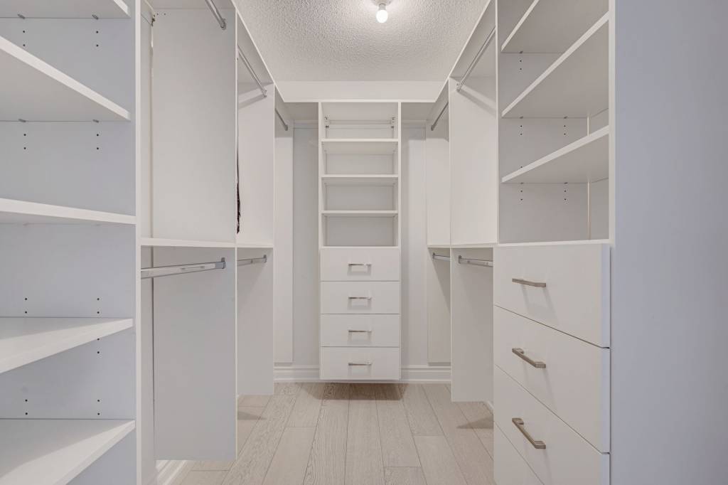 walk in closet with custom cabinets - custom closet shelving