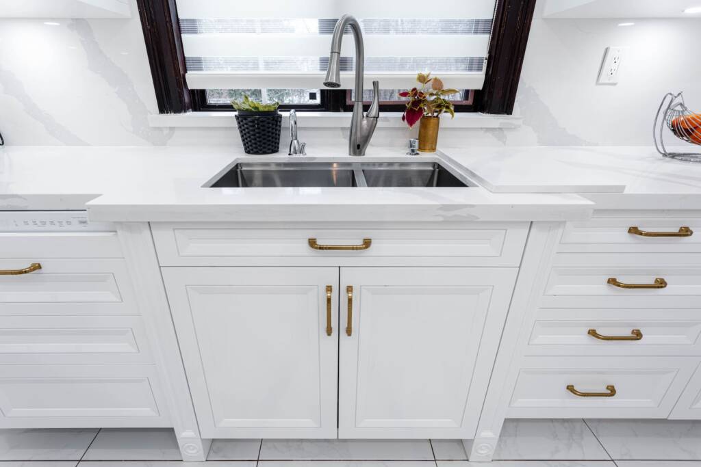 white tile counterop kitchen sink with drawers