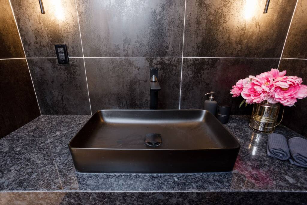 contemporary bathroom sink with black wall in richmond hill